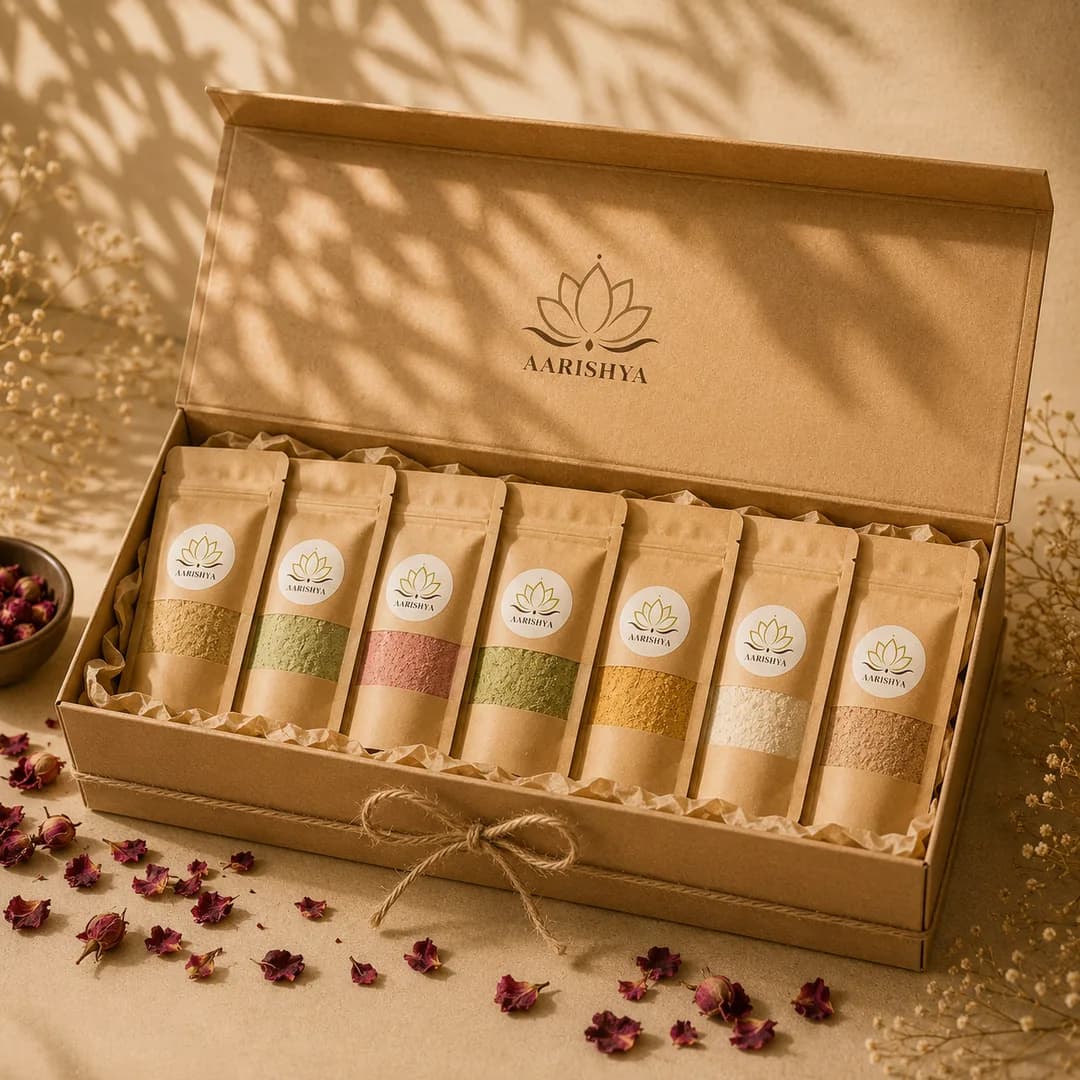 The Aarishya gift box, seven kraft pouches tied with twine in a lotus-stamped box